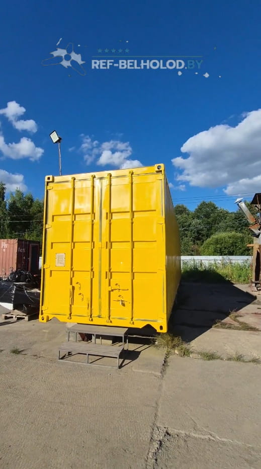 Bright yellow shipping container after restoration and repainting